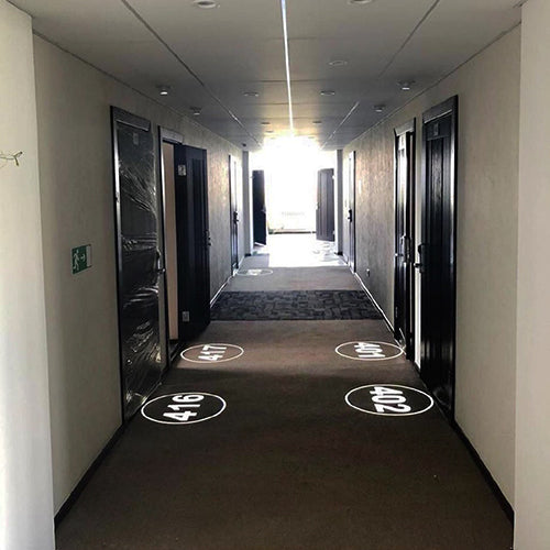 How Recessed Low-Wattage Projection Devices Transform Hotel Room Number Signage